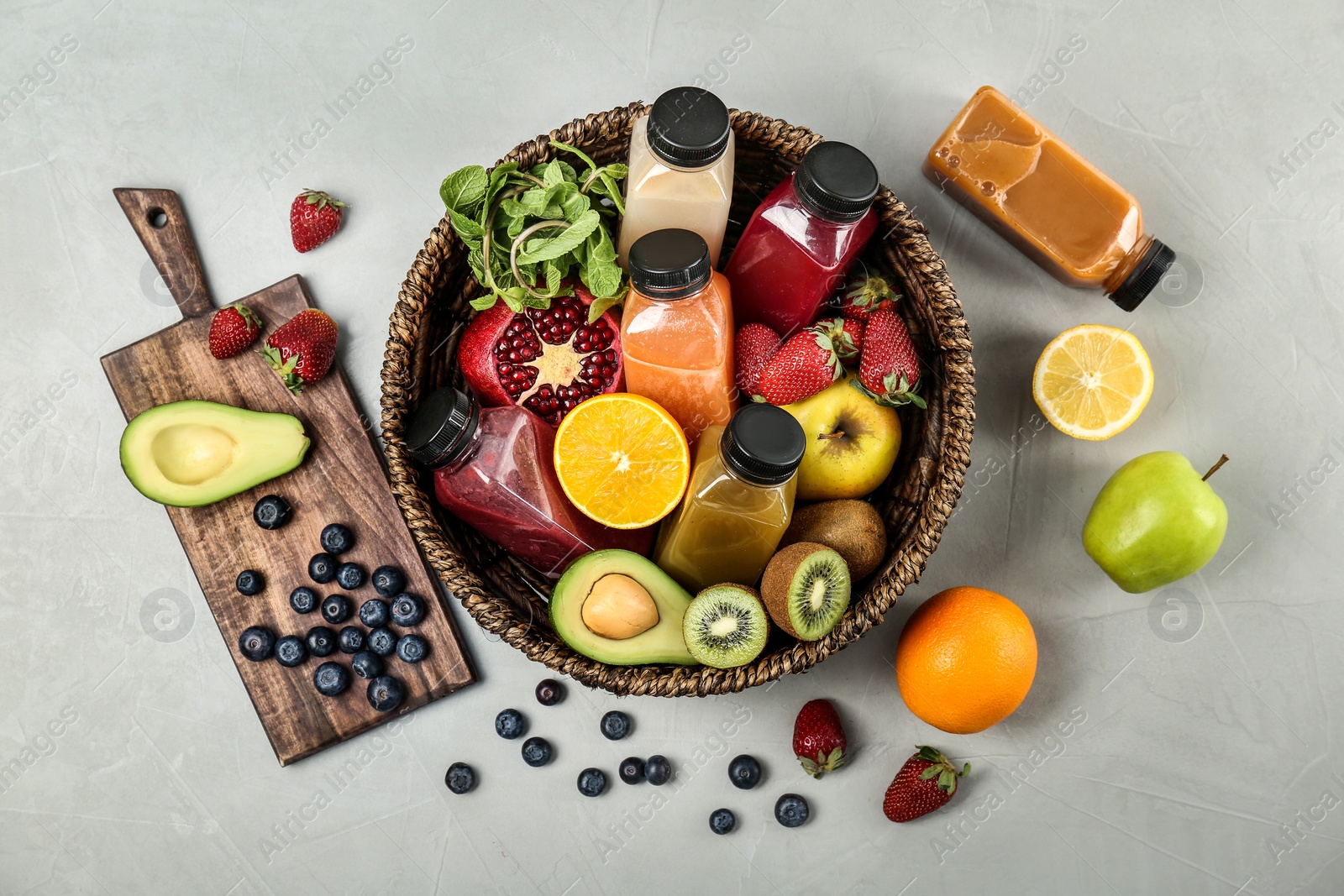 Photo of Flat lay composition with healthy detox smoothies and ingredients on light background