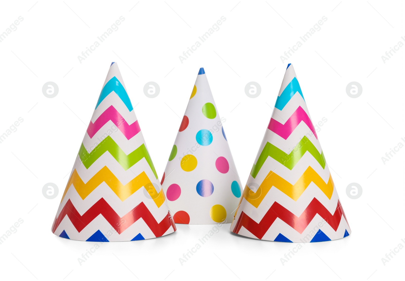 Photo of Bright birthday party hats on white background