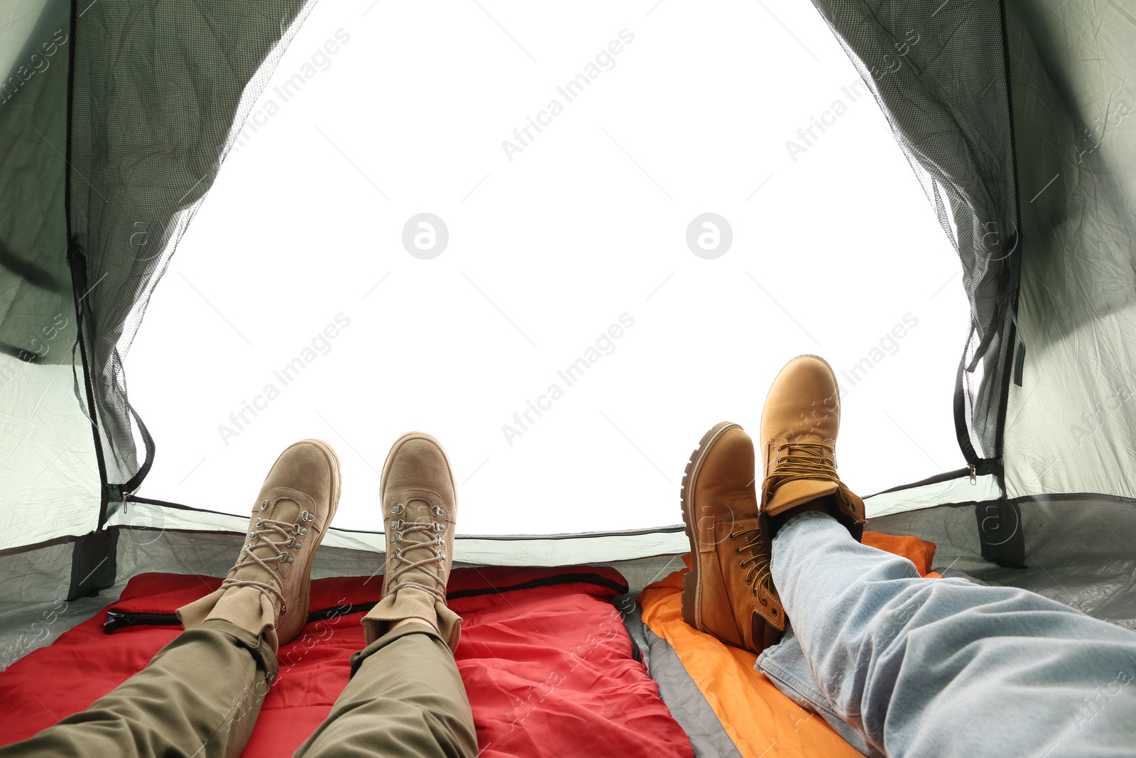 Photo of Closeup of couple in camping tent on white background, view from inside