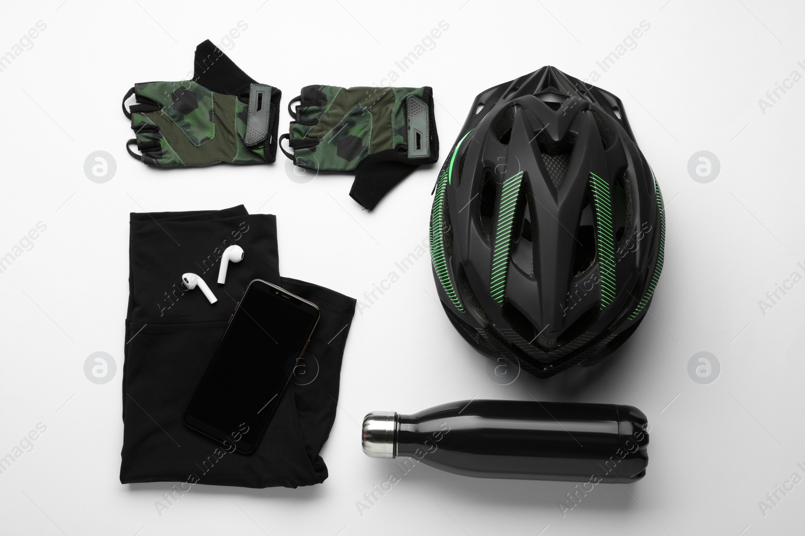 Photo of Flat lay composition with different cycling accessories and clothes on white background