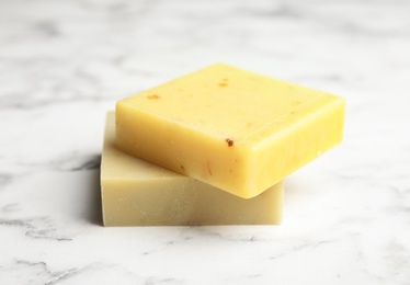 Photo of Hand made soap bars on marble background