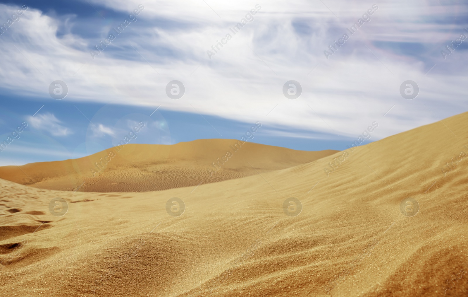 Image of Picturesque view of sandy desert and blue sky on hot sunny day 