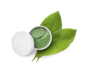 Photo of Jar of under eye patches and green leaves isolated on white, top view. Cosmetic product