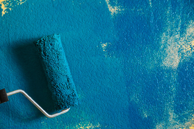 Photo of Painting wall with blue dye, closeup view