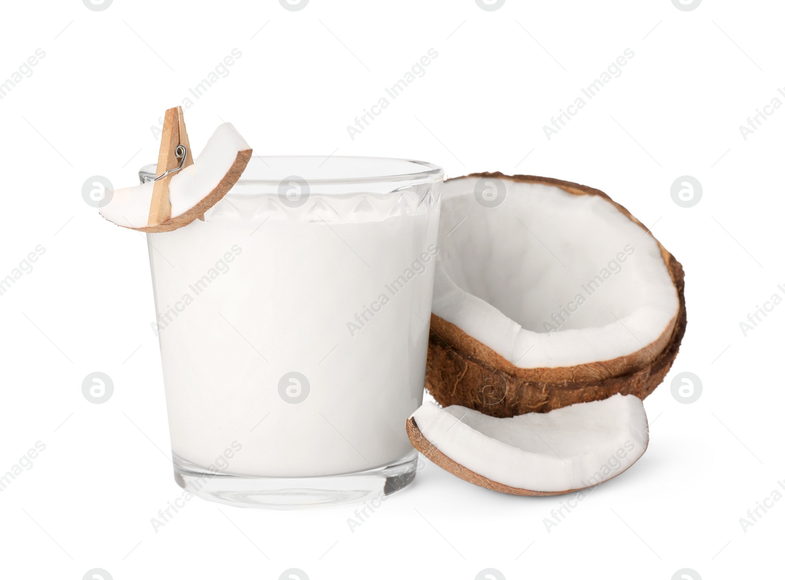 Photo of Glass of delicious vegan milk and coconut pieces on white background