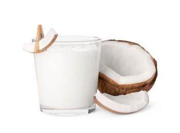 Photo of Glass of delicious vegan milk and coconut pieces on white background