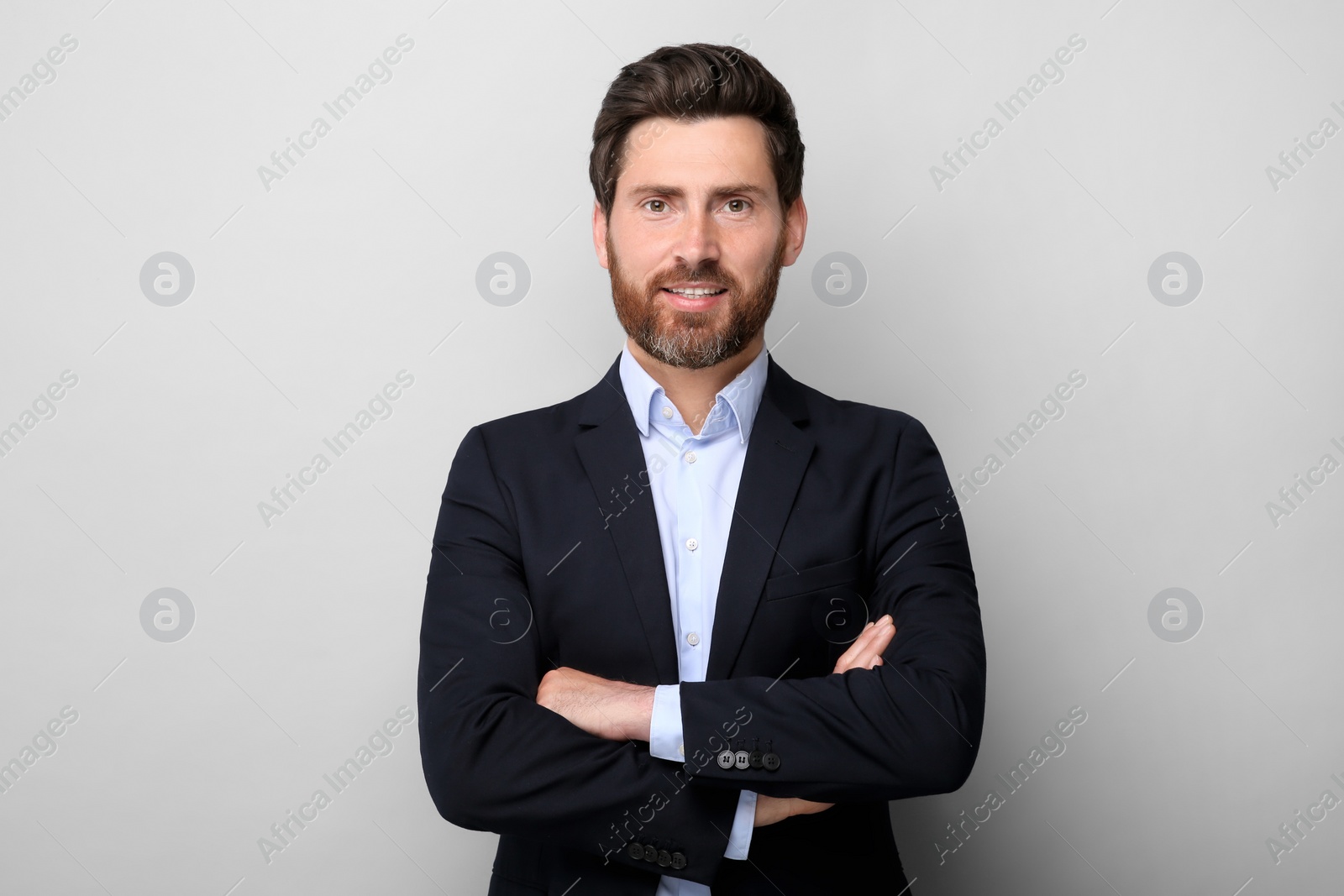 Photo of Portrait of handsome man on light grey background