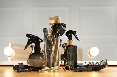 Set of hairdresser tools on table in salon