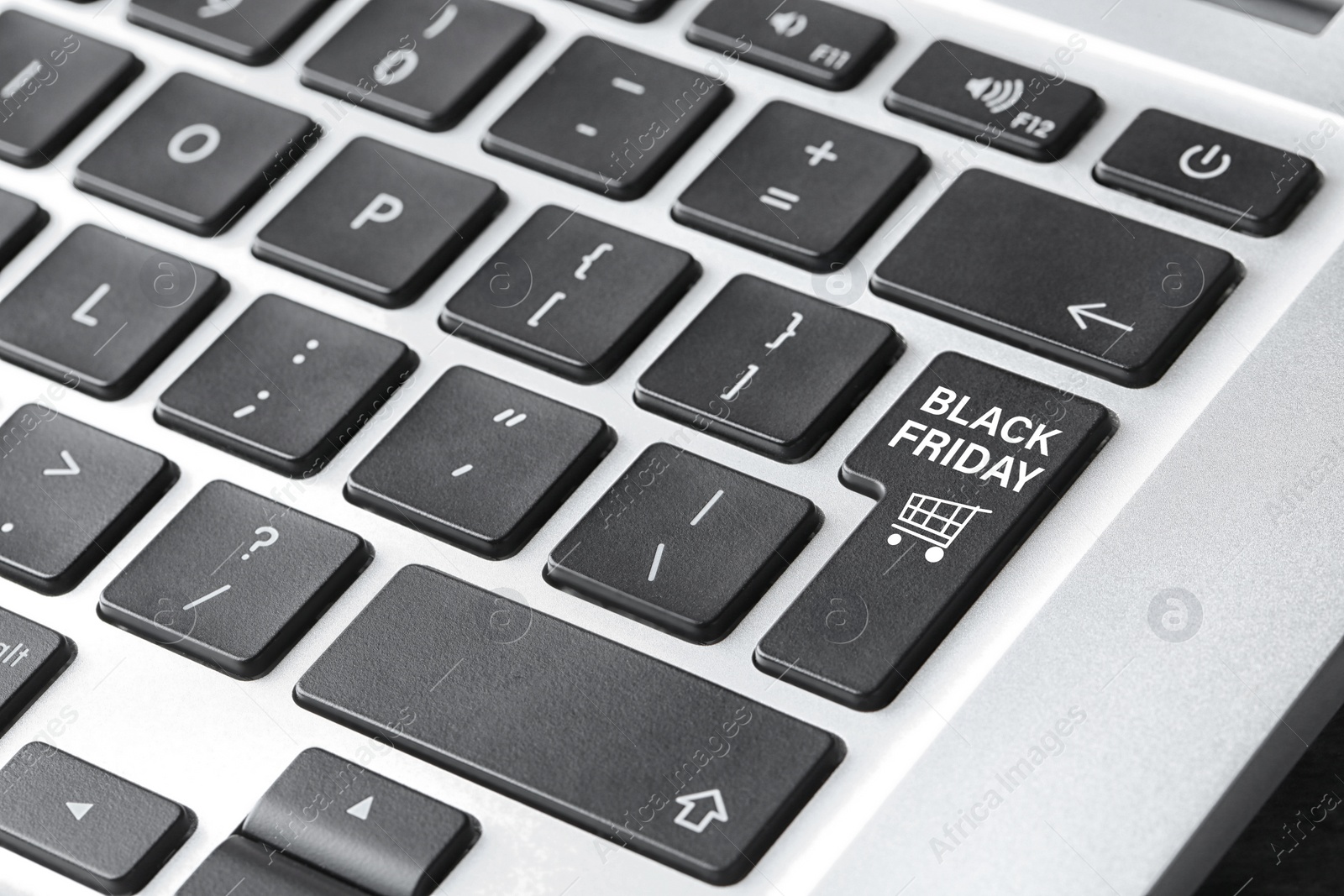 Image of Laptop keyboard with Black Friday button, closeup. Online shopping 