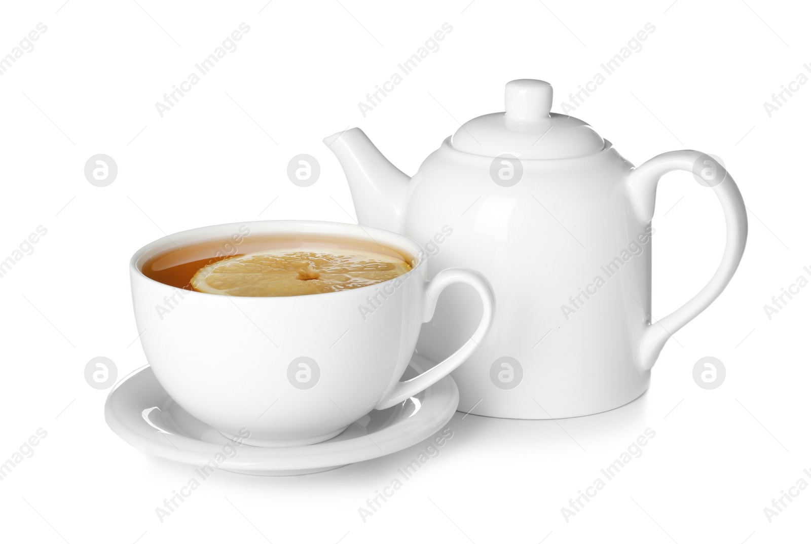 Photo of Teapot and cup of tea with lemon on white background