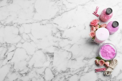 Photo of Flat lay composition with handmade rose candle on marble background. Space for text