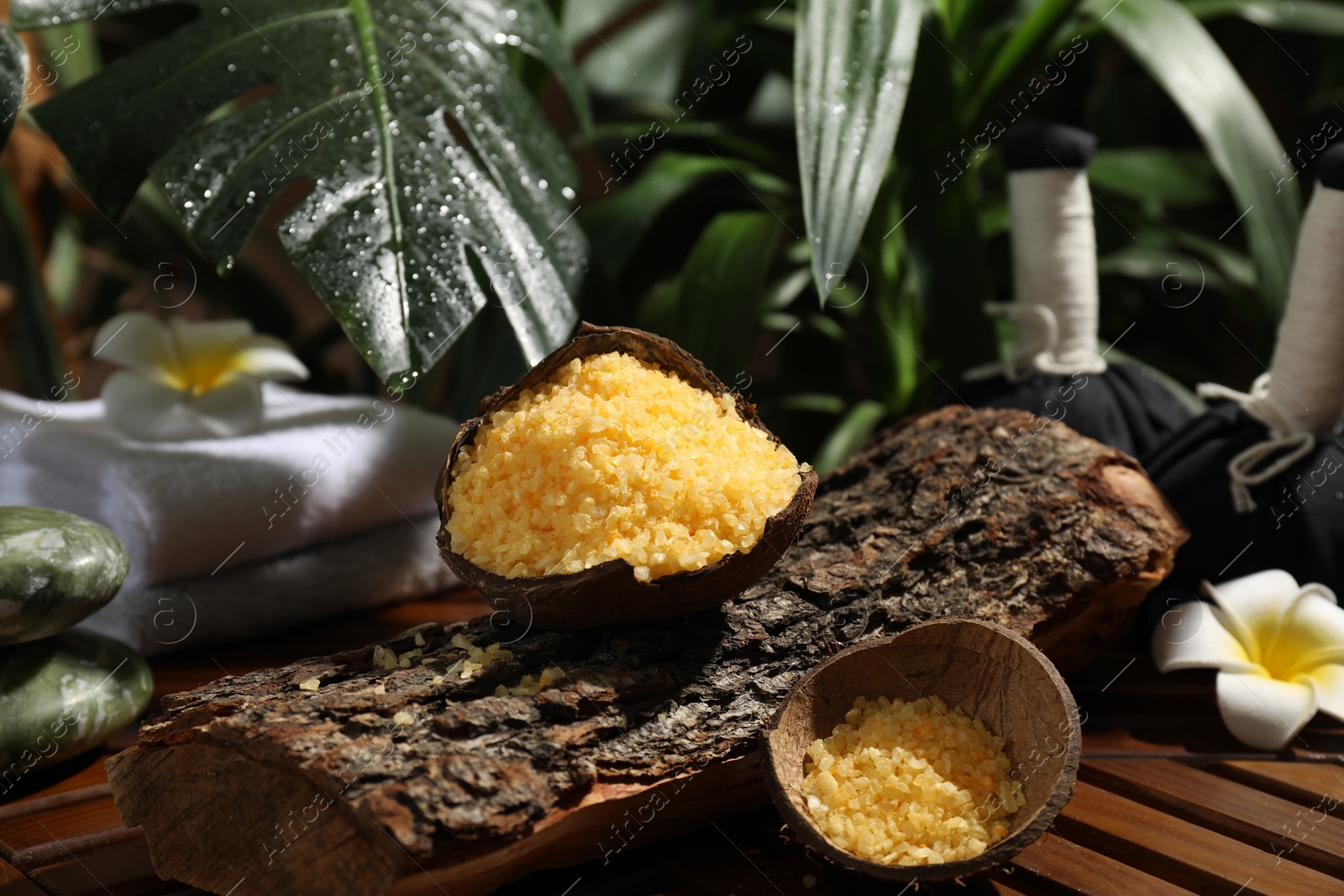 Photo of Spa composition with orange sea salt on wooden table