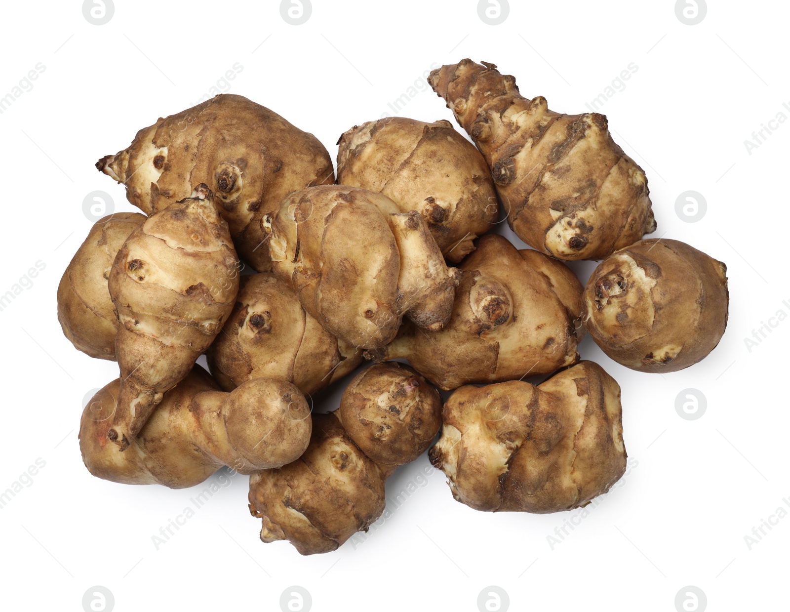 Photo of Jerusalem artichokes isolated on white, top view