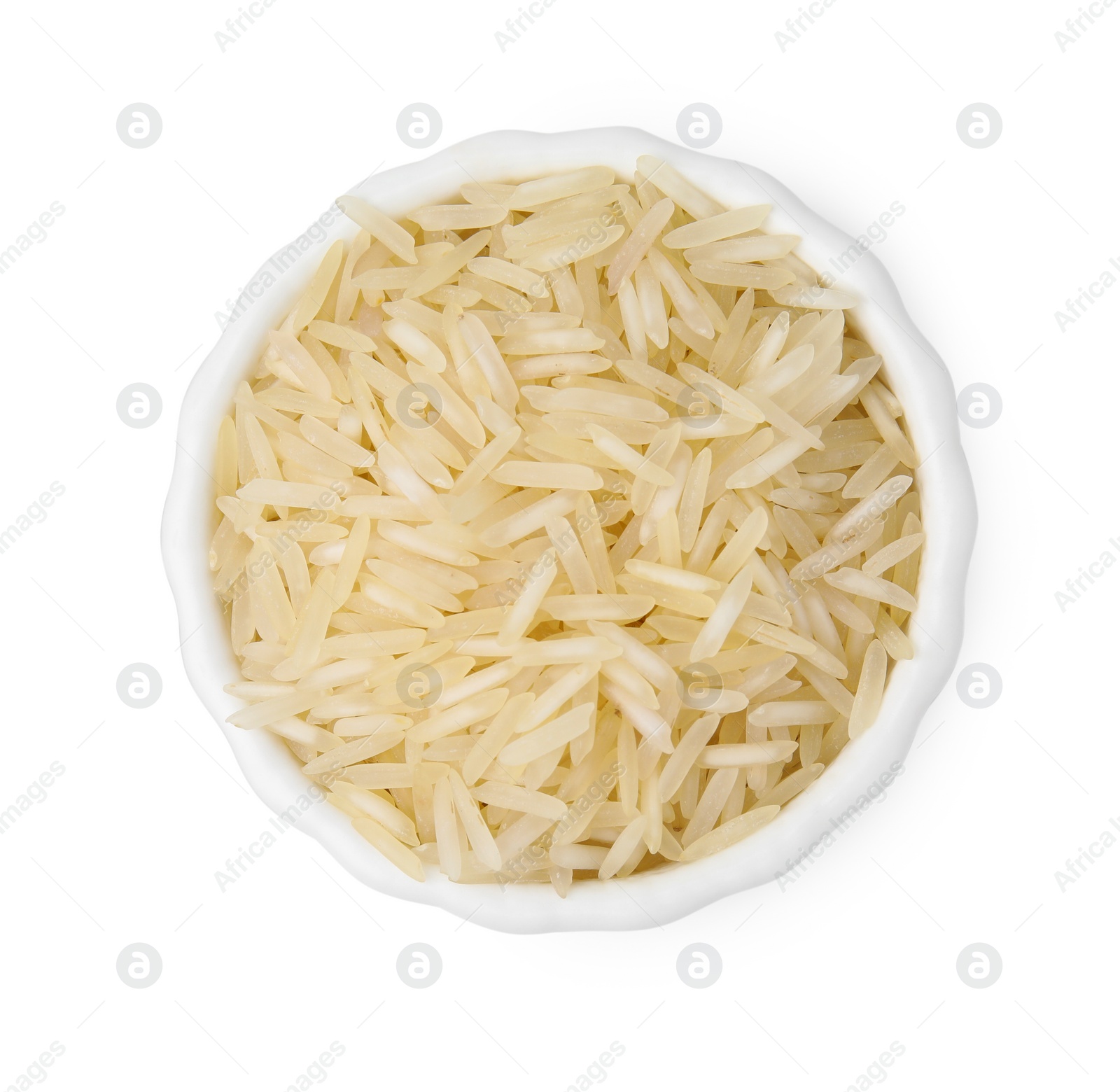 Photo of Raw rice in bowl isolated on white, top view
