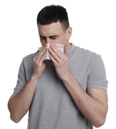 Photo of Man blowing nose in tissue on white background. Cold symptoms