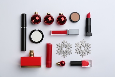 Photo of Flat lay composition with decorative cosmetic products on light background. Winter care