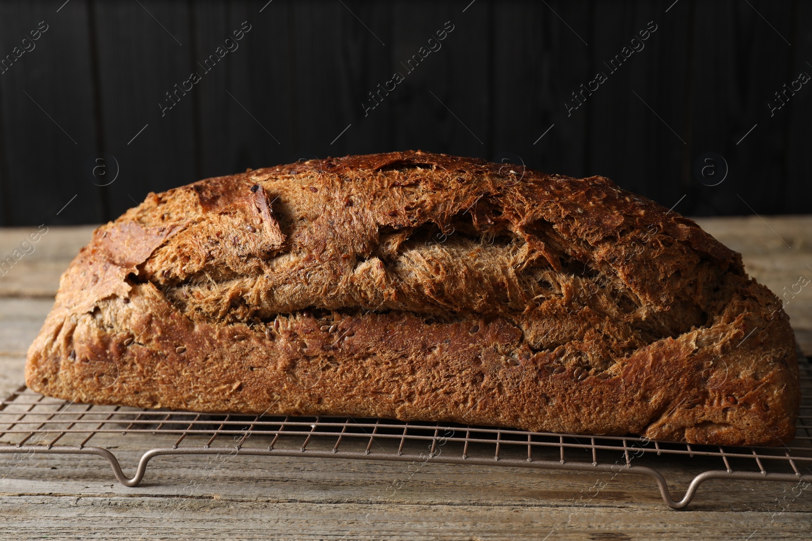 Photo of Freshly baked sourdough bread on wooden table