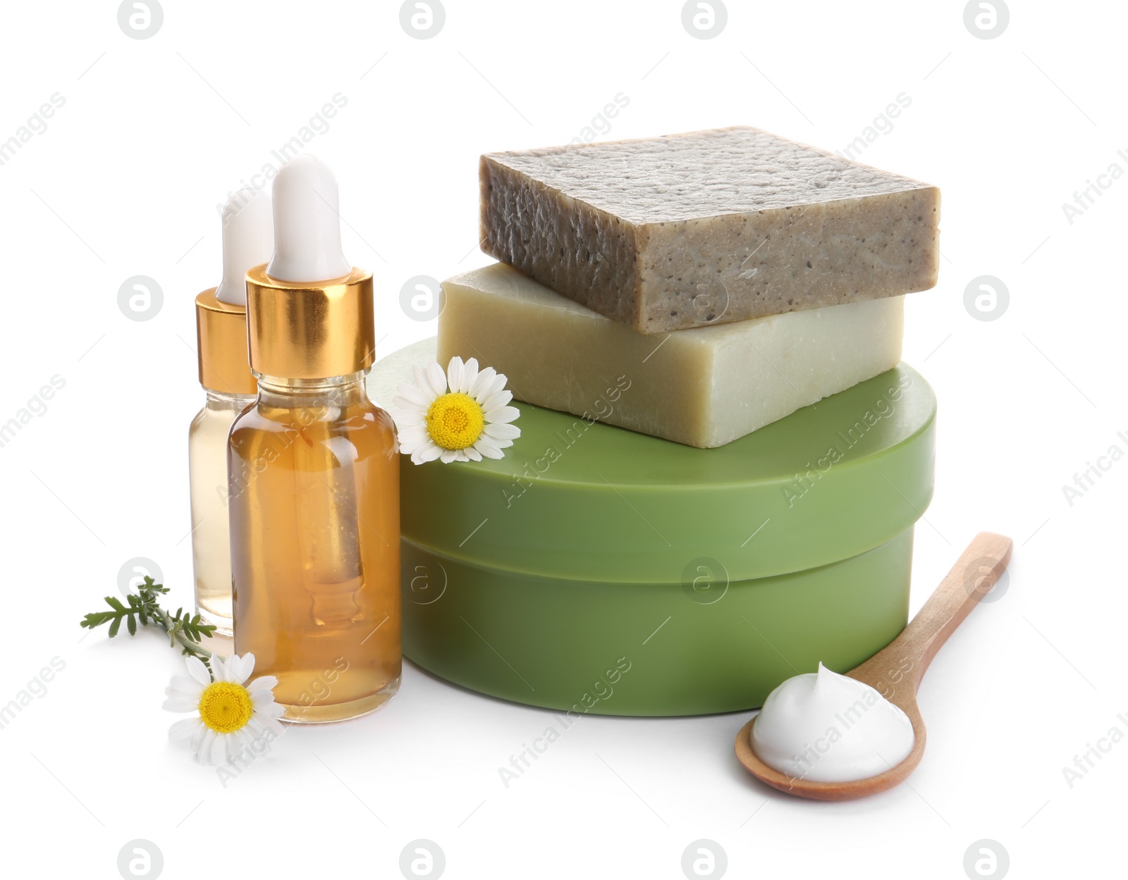 Photo of Set of different cosmetic products and chamomile flowers on white background