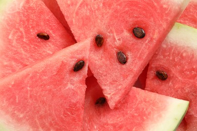 Photo of Delicious fresh watermelon slices as background, closeup