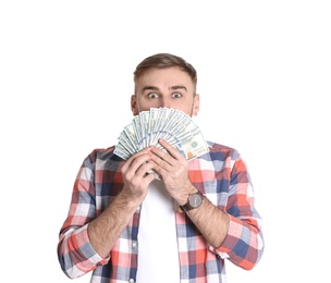 Portrait of young man holding money banknotes on white background