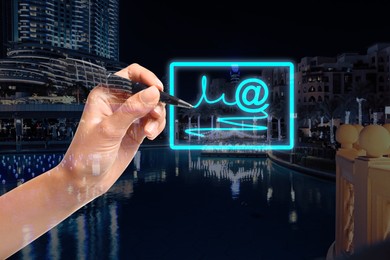 Image of Electronic signature concept. Double exposure of woman with pen near virtual screen and night cityscape