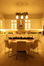 Cozy spacious kitchen decorated for Christmas. Interior design