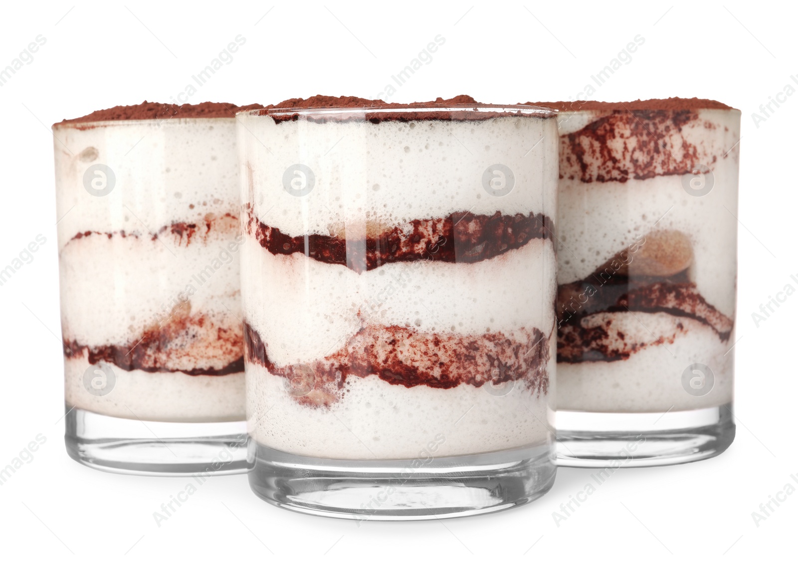 Photo of Delicious tiramisu in glasses isolated on white