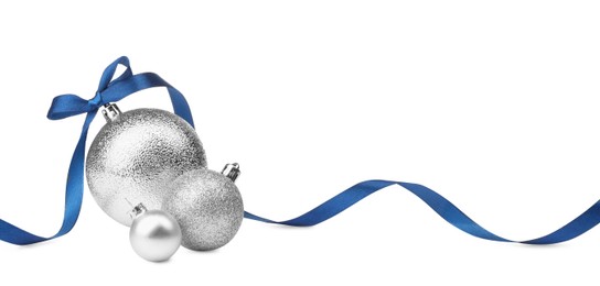 Beautiful Christmas balls and blue ribbon isolated on white