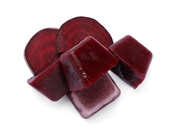 Photo of Frozen beetroot puree cubes and fresh beetroot isolated on white, top view