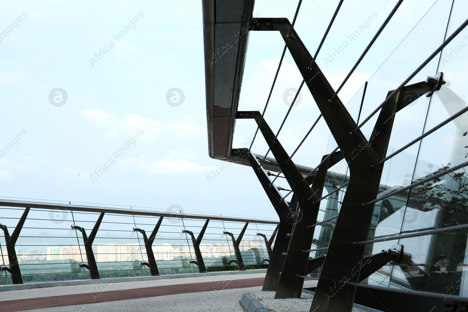 Photo of KYIV, UKRAINE - AUGUST 11, 2022: Pedestrian park bridge on summer day, closeup