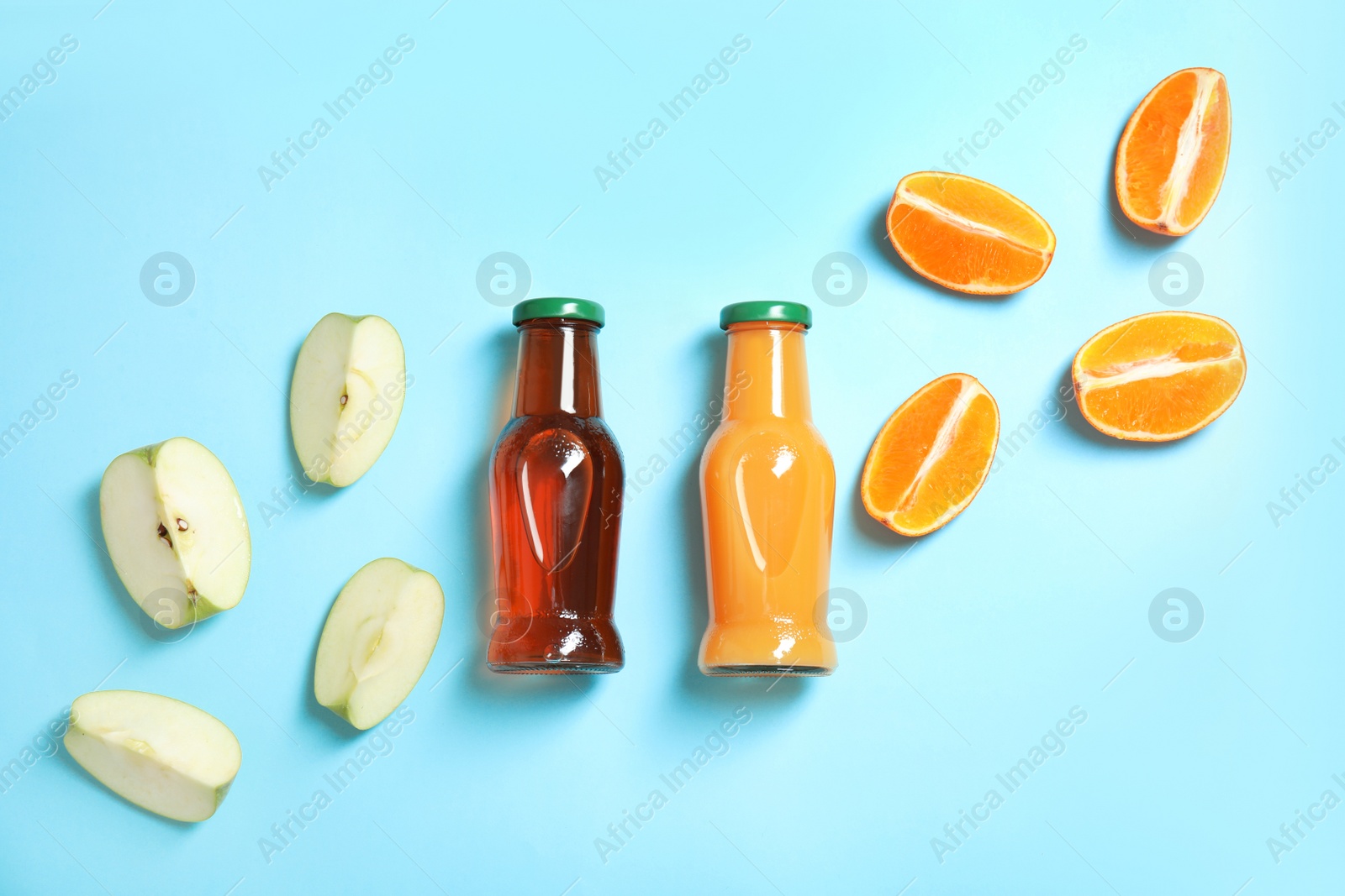 Photo of Flat lay composition with different drinks in bottles and ingredients on color background