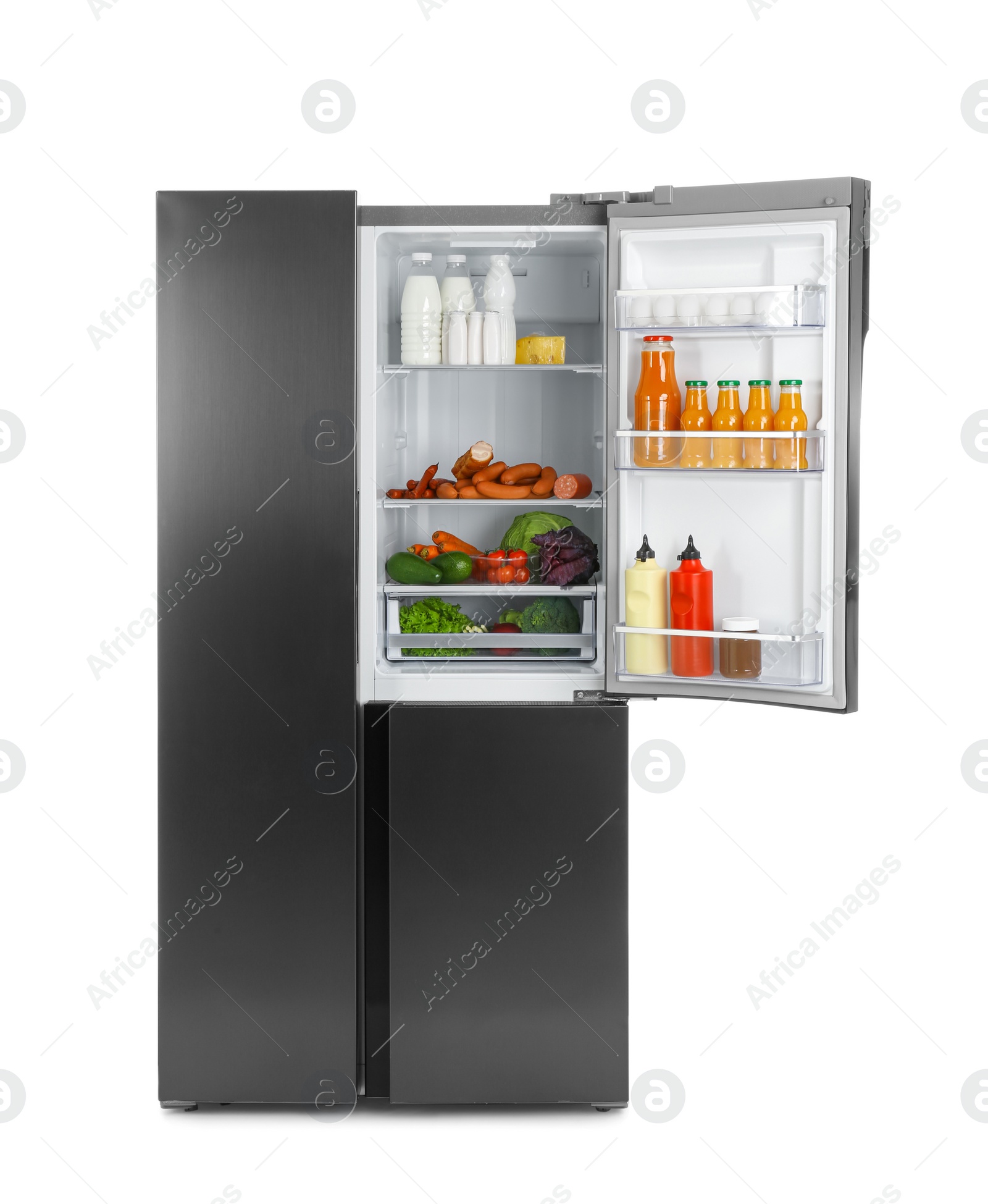 Photo of Open refrigerator filled with products isolated on white