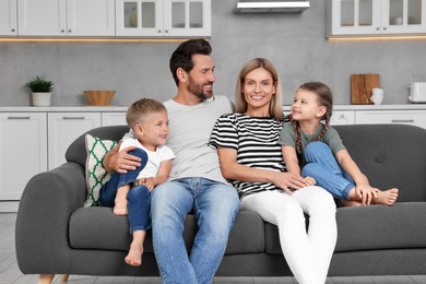 Photo of Portrait of happy family with children on sofa at home