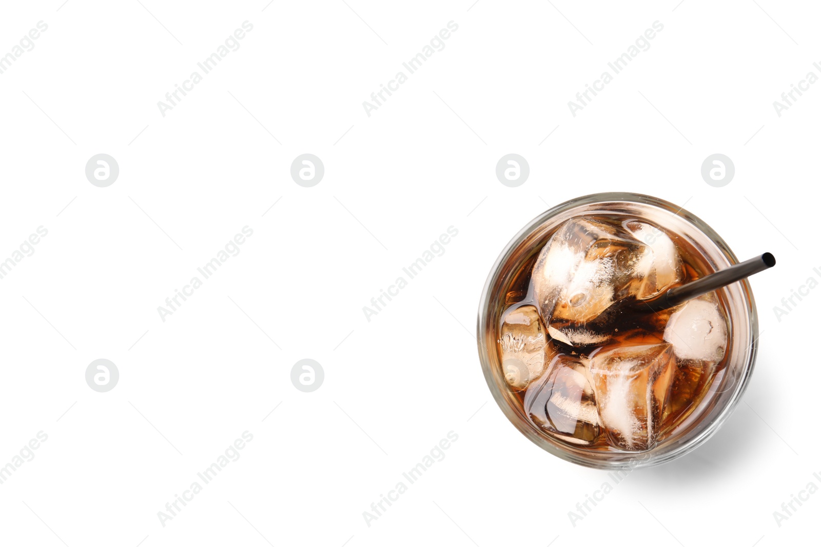 Photo of Glass of refreshing cola with ice on white background, top view. Space for text