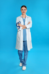 Portrait of doctor with stethoscope on blue background