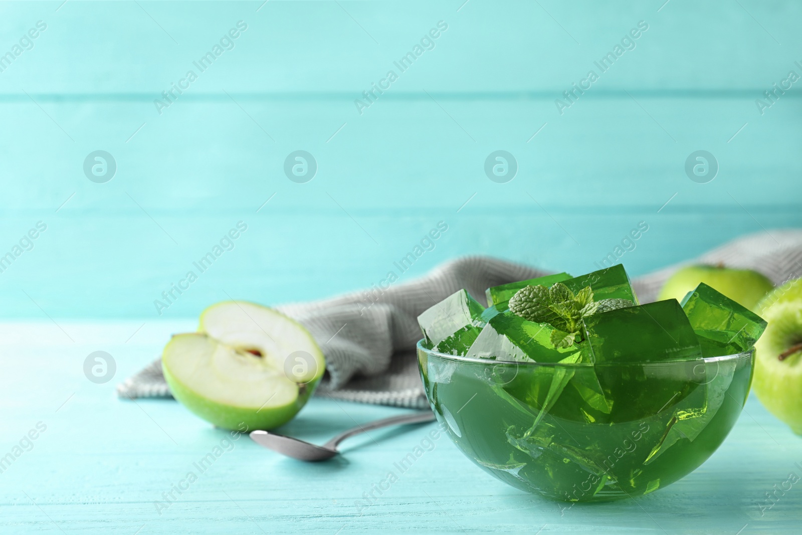 Photo of Bowl of tasty jelly on table. Space for text