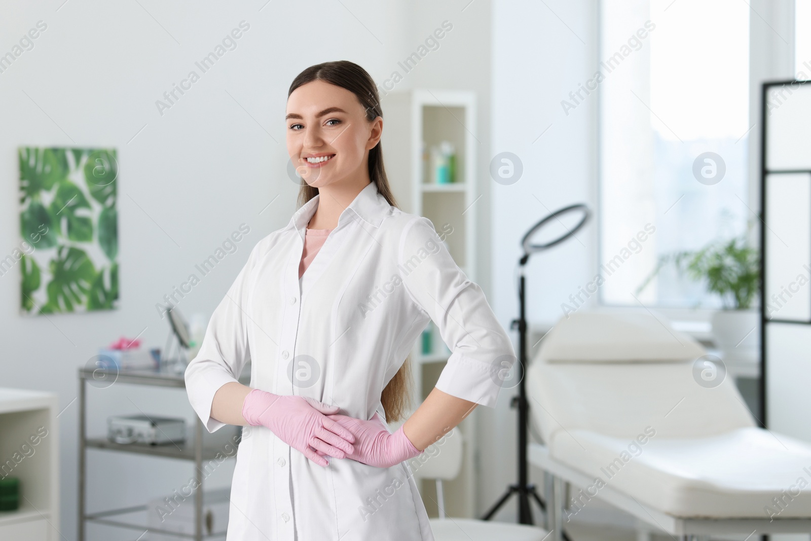 Photo of Professional cosmetologist in medical uniform in clinic