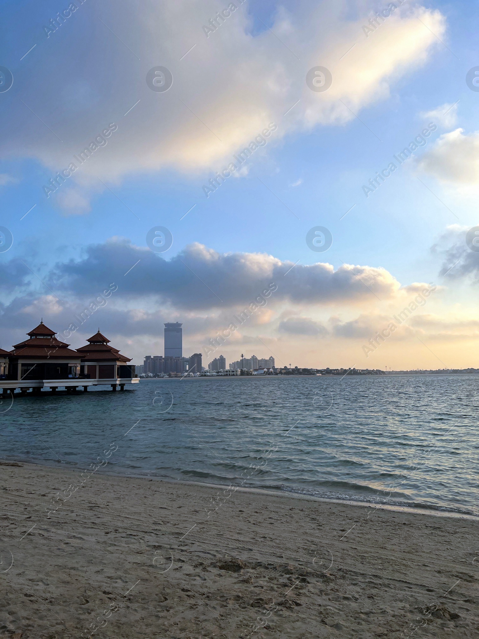 Photo of Beautiful view of sea and resort at sunset