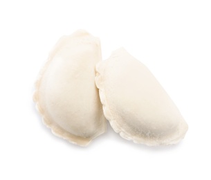 Tasty raw dumplings on white background, top view