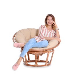 Photo of Young woman sitting in armchair on white background