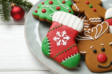 Tasty homemade Christmas cookies on white wooden table, closeup