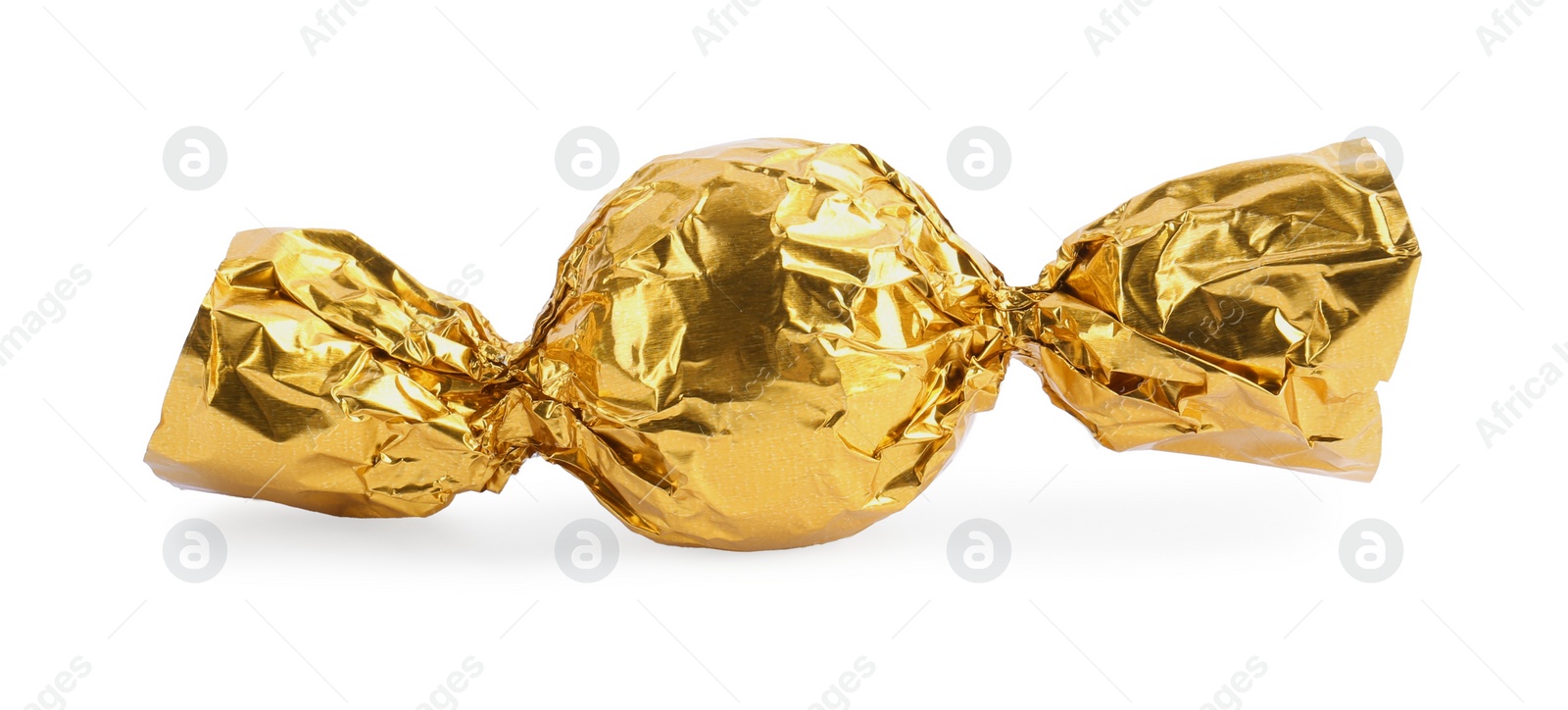 Photo of Tasty candy in yellow wrapper isolated on white
