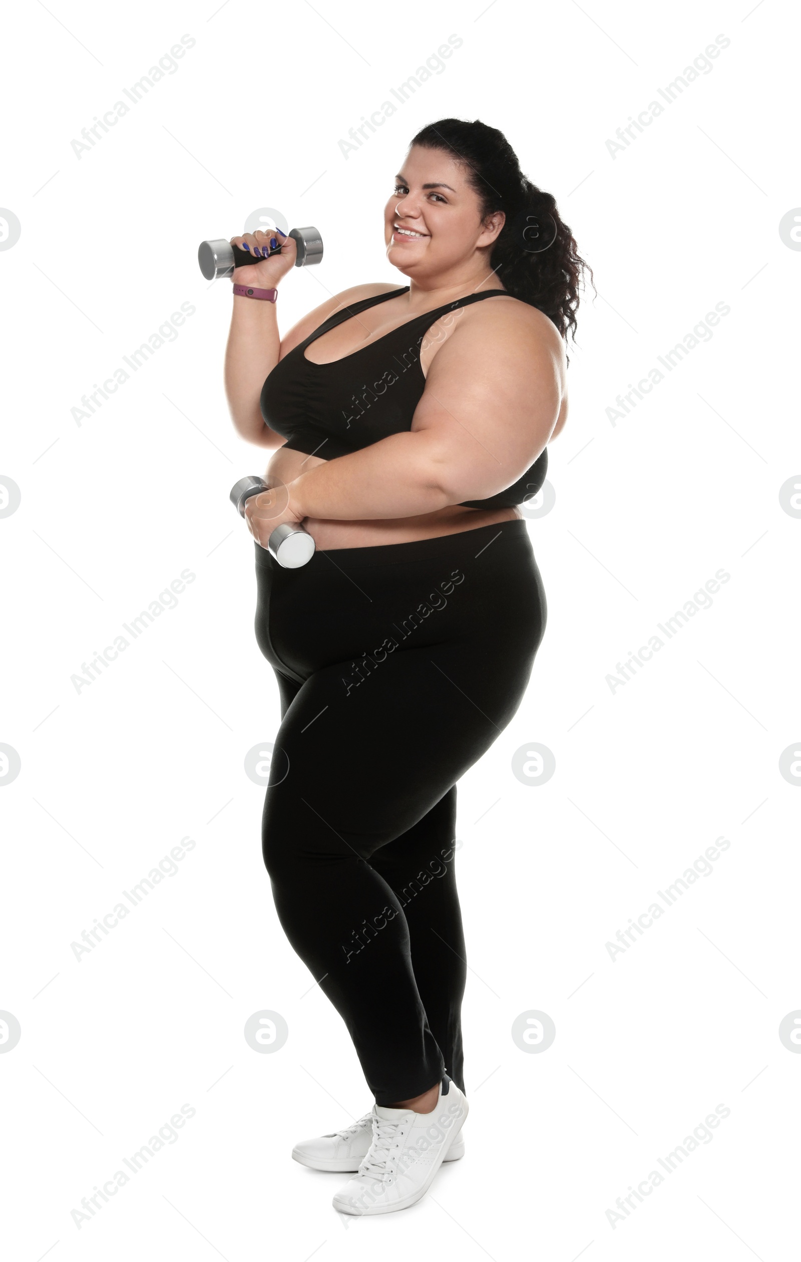 Photo of Overweight woman with dumbbells on white background