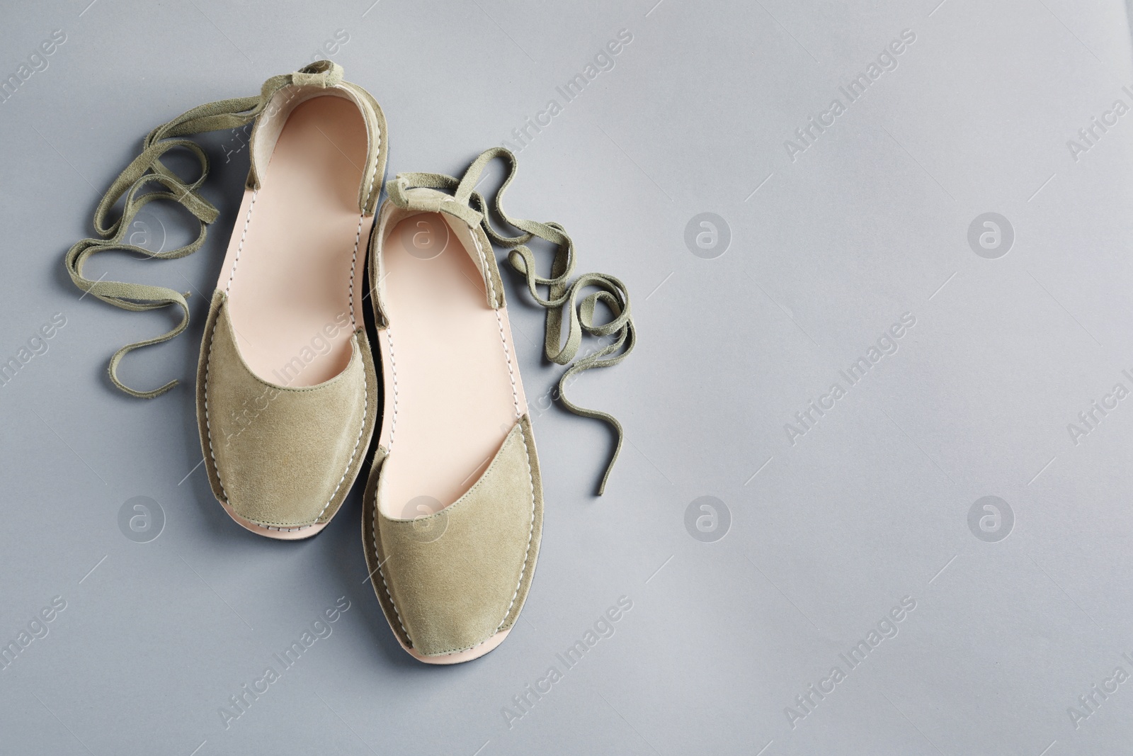 Photo of Pair of trendy women's shoes on color background