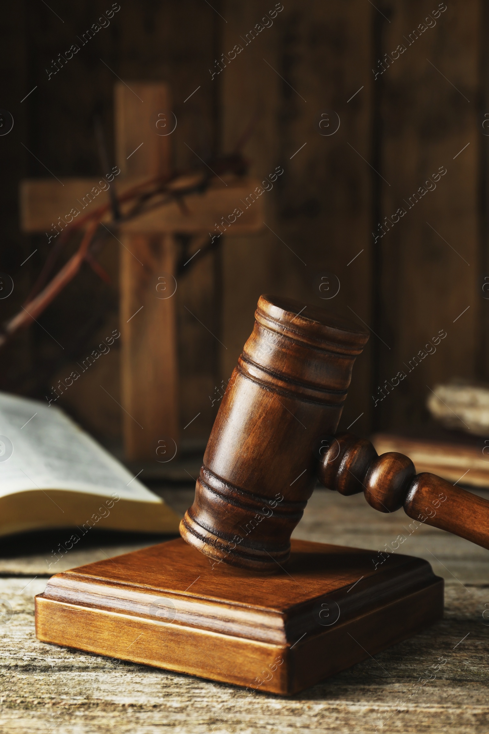 Photo of Judge gavel on old wooden table, closeup