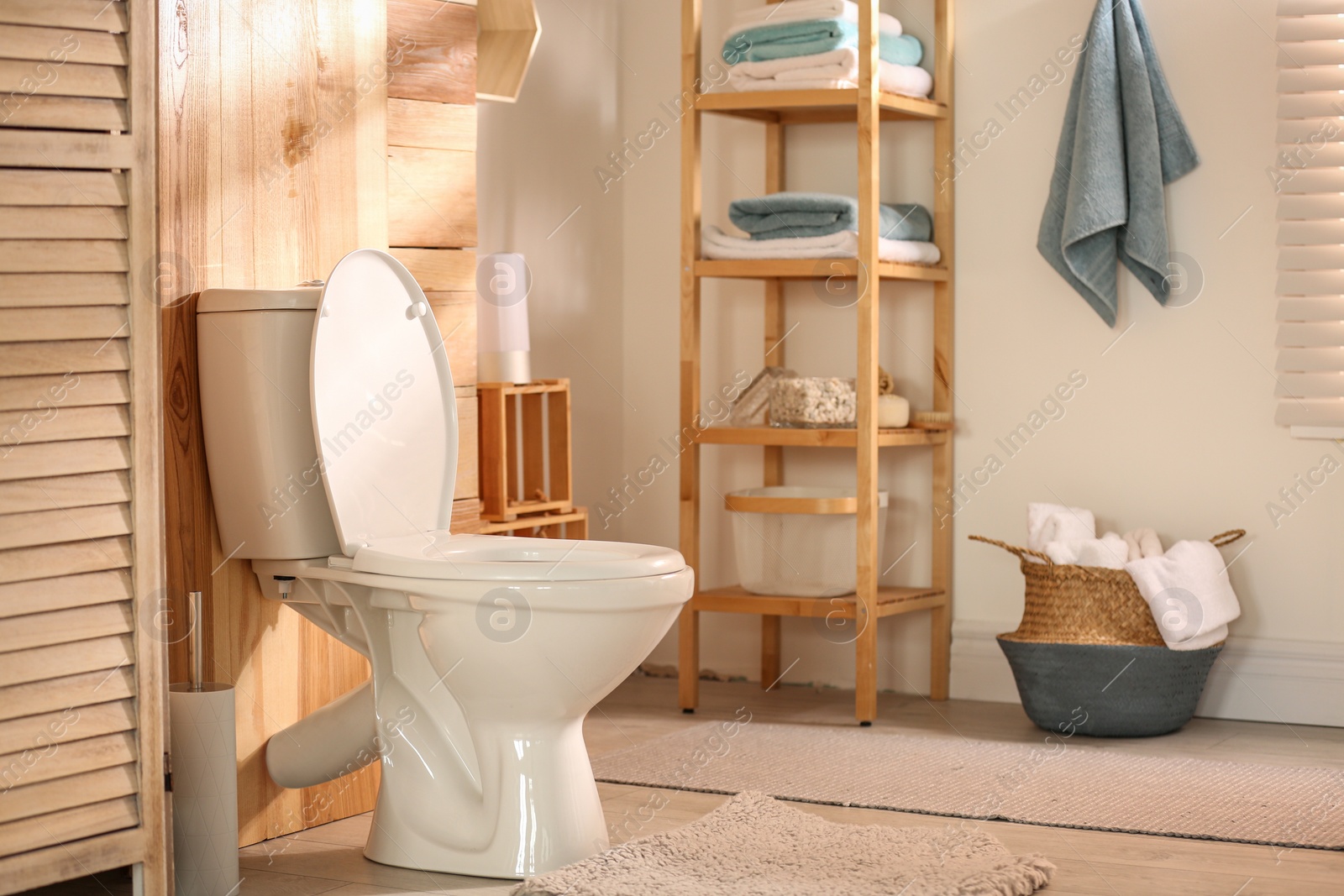 Photo of Modern toilet bowl in stylish bathroom interior