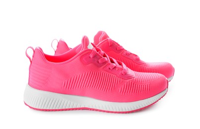 Photo of Pair of stylish pink sneakers on white background