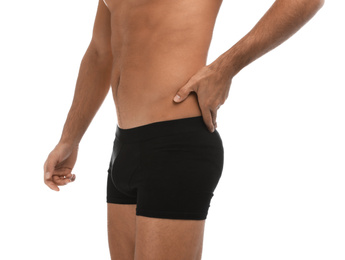 Photo of Man in black underwear on white background, closeup