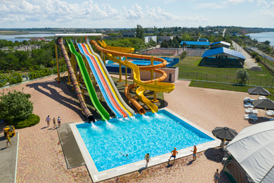 Image of Aerial view of water park on sunny day