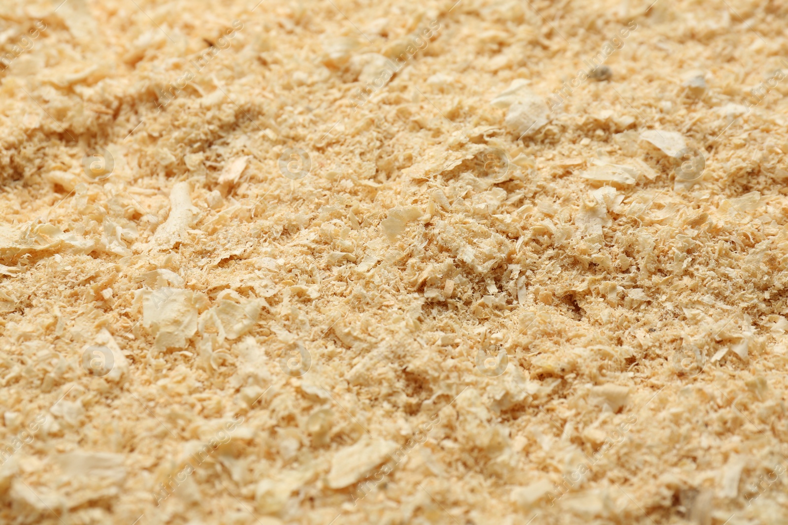 Photo of Dry natural sawdust as background, closeup view